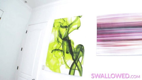 White room interior with green abstract smoke painting and purple striped art on walls with Swallowed.com watermark