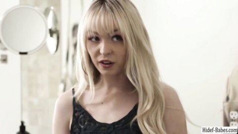 Blonde London River in black lace lingerie, seductive open-mouth tease