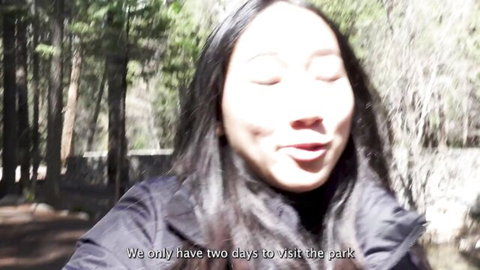 Luna Okko smiles in forest park during outdoor adventure