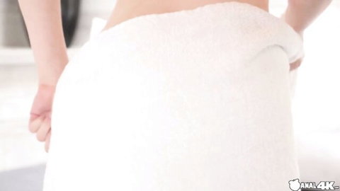 Slim woman in white towel from behind, teasing ass view