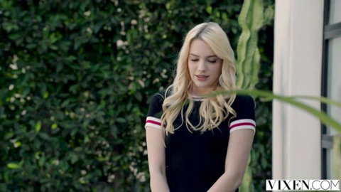 Blonde Kenna James in striped black top, teasing outdoors for VIXEN threesome