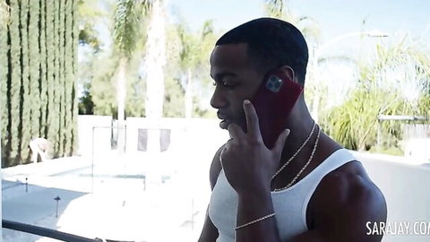 Muscular black stud on phone in tank top for Sara Jay's interracial BBC hardcore