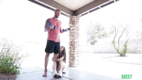 Penelope Kay petite brunette kneels for handjob on muscular man