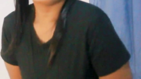 Sexy Sri Lankan teen in tight black V-neck top teasing with cleavage