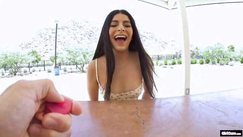 Angel Gostosa smiles teasingly with pink vibrator in POV outdoor shot