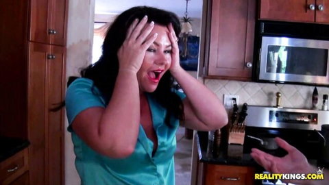 Surprised MILF Brooklyne in low-cut satin blouse, hand reaching out