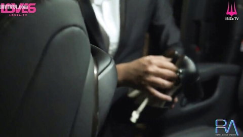 Suited man gripping steering wheel in luxury car for BDSM boss mistress fantasy