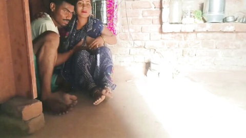 Desi bhabhi in blue saree embraced by lover in intimate rural moment