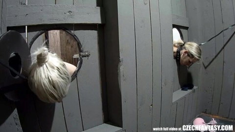 Blonde Czech MILF tied up through wall in wild party bondage scene