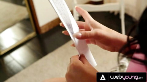 Kenzie Reeves and Jade Baker holding a mysterious note in steamy threesome tease