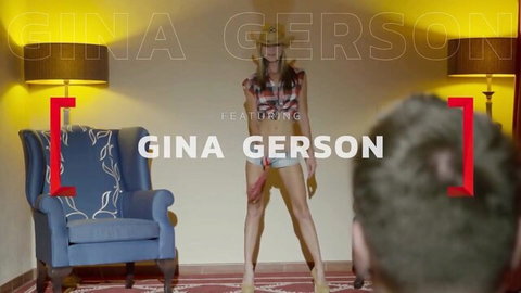 Gina Gerson posing seductively in open plaid shirt and shorts
