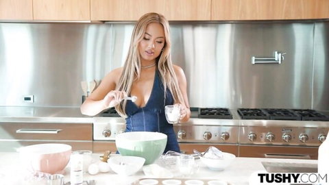 Kazumi Squirts in sexy blue dress mixing batter in kitchen tease