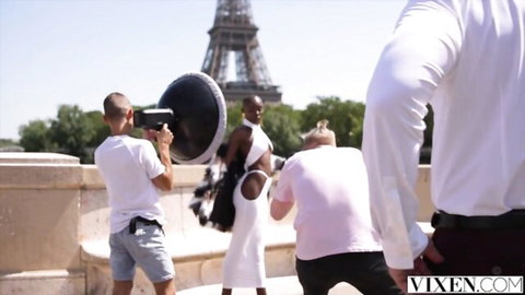 Gorgeous African babe in cutout dress posing at Eiffel Tower photoshoot