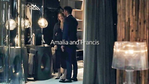 Amalia Davis in sexy black dress teasing with suited man