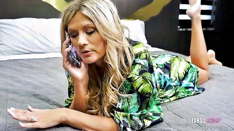 Ellie Tay in green robe, blonde stepmom on phone teasing on bed