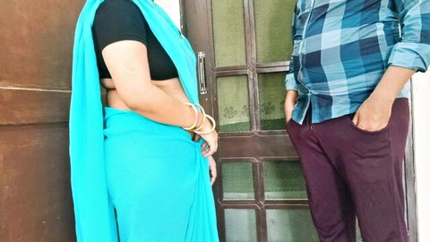 Curvy Indian housewife in blue saree posing with partner outdoors