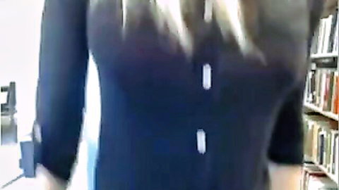 Naughty blonde student teases with cleavage in library