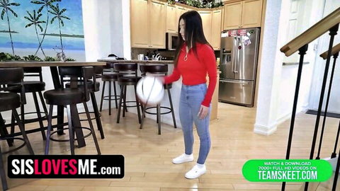 Sexy Asian teen in tight jeans and red top holds basketball, teasing stepbro
