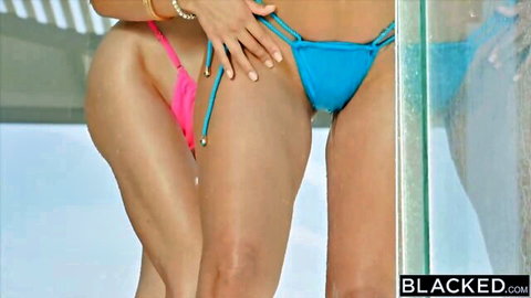 Rae Lil Black in blue string bikini with Vicki teasing curves