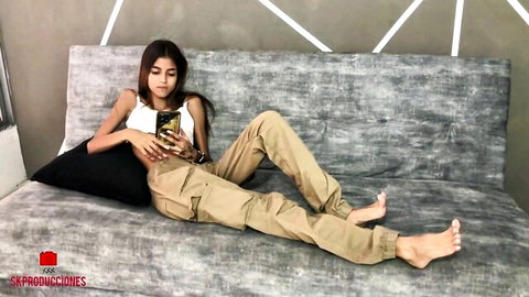 Indian Desi MILF lounging on couch in tank top and cargo pants, POV homemade thumbnail