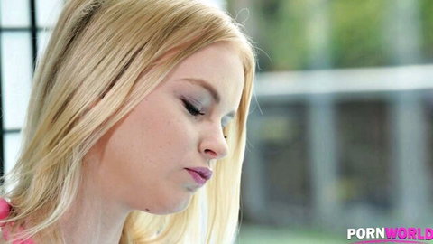 Closeup of sexy blonde teen's pouty lips and fair face in profile view