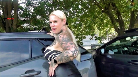 SteffiBlond tattooed blonde with huge tits in zebra top leaning on car