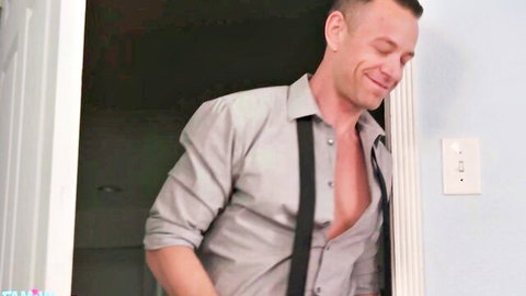 Brad Newman smiling in open gray shirt and suspenders, muscular chest exposed