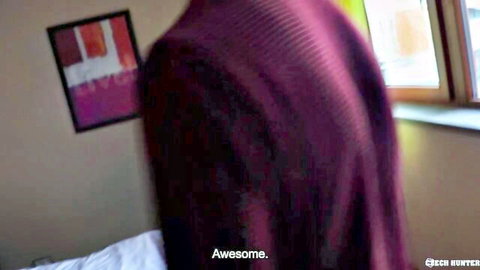 Muscular man in tight purple sweater viewed from behind in bedroom with awesome text overlay