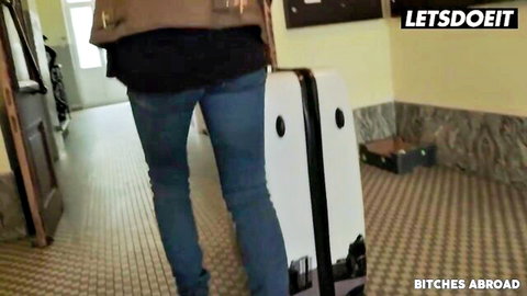 Dominica Phoenix in tight jeans, walking with suitcases in abroad adventure