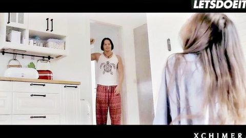 Jessica X in teasing kitchen encounter with man, blonde from behind in sheer top