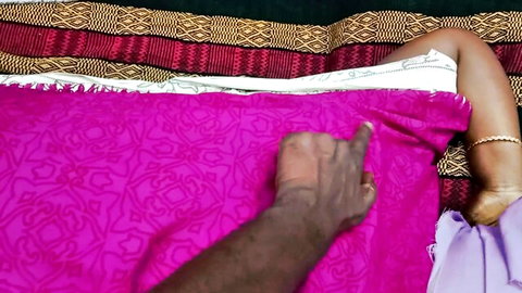 Tamil babe in pink saree with hand pulling fabric exposing thigh
