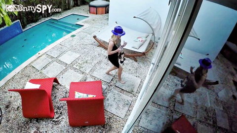 Anastasia Knight in black dress and purple hat, teasing by pool in nanny spy scene