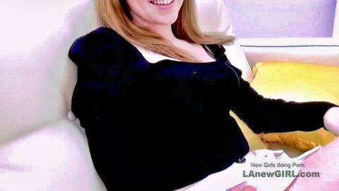 Blonde bombshell CarryLight smiling in sexy black off-shoulder top