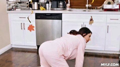 Marica Hase bent over in pink pajamas teasing ass in kitchen