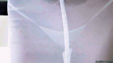 Close-up of fair-skinned woman's sheer white thong clinging to shaved pussy with visible cameltoe