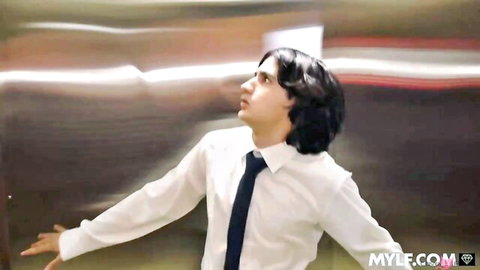 Young man in white shirt and tie in elevator for MILF threesome action