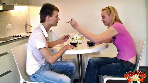 Blonde teen Alisa and Eugen sharing tea in kitchen before hardcore pounding