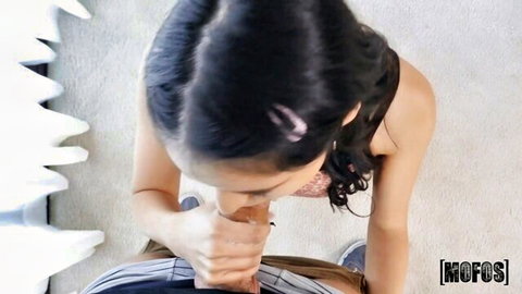 Brunette teen kneels sucking thick cock with hand grip in intense POV blowjob closeup