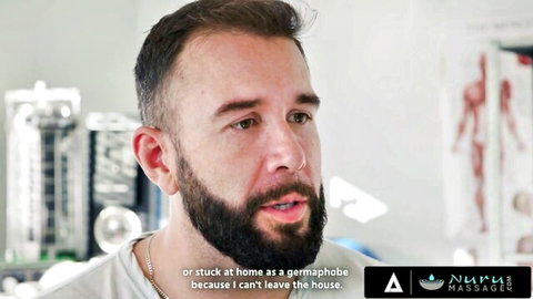 Bearded doctor in lab talks germaphobe fears in steamy Nuru Massage promo video
