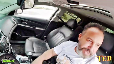 Bearded man in car selfie on way to beach boner show with legs and ass