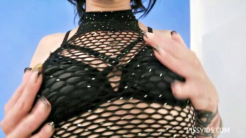 Brunette babe squeezes her huge tits through sparkly black mesh top