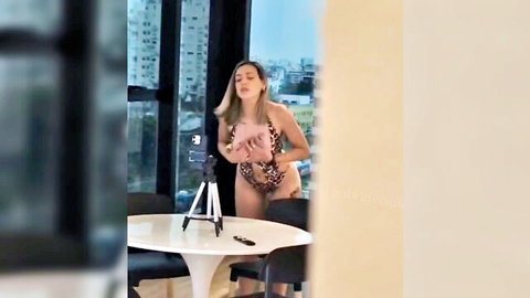 Blonde stepmom in leopard bikini posing with huge tits tease