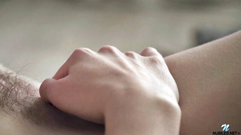 Hot redhead hand gripping intimately in solo sock play