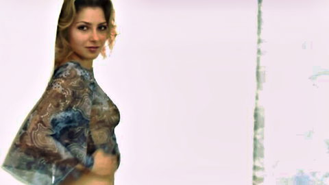 Bonita in sheer patterned top, teasing solo pose