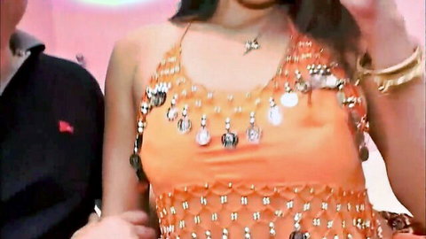 Busty Indian teen in orange beaded top posing with man, explicit pounding ahead