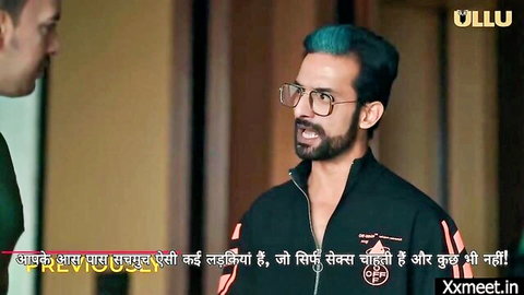 Intense Indian man with blue hair in glasses yells about horny sisters craving rough sex in Ullu series