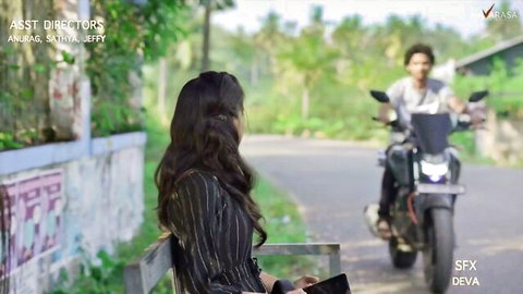 Indian small-titted nubile in black dress sits by motorcycle outdoors