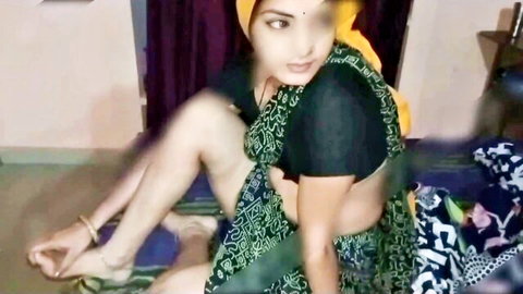 Indian Desi landlady Radha786 in green saree, seductive sitting pose