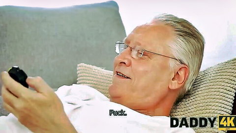 Silver-haired stepdad lounging on couch in teasing Daddy 4K thumbnail