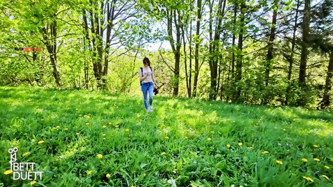 BettDuett smiling outdoors in field, POV hike tease